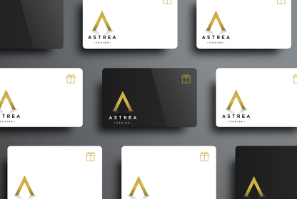 several Astrea Caviar gift cards are displayed on a table
