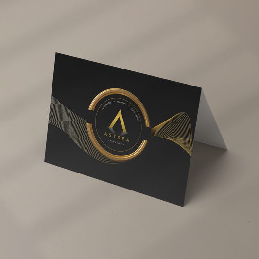 an Astrea Caviar greeting card standing up on a beige surface 