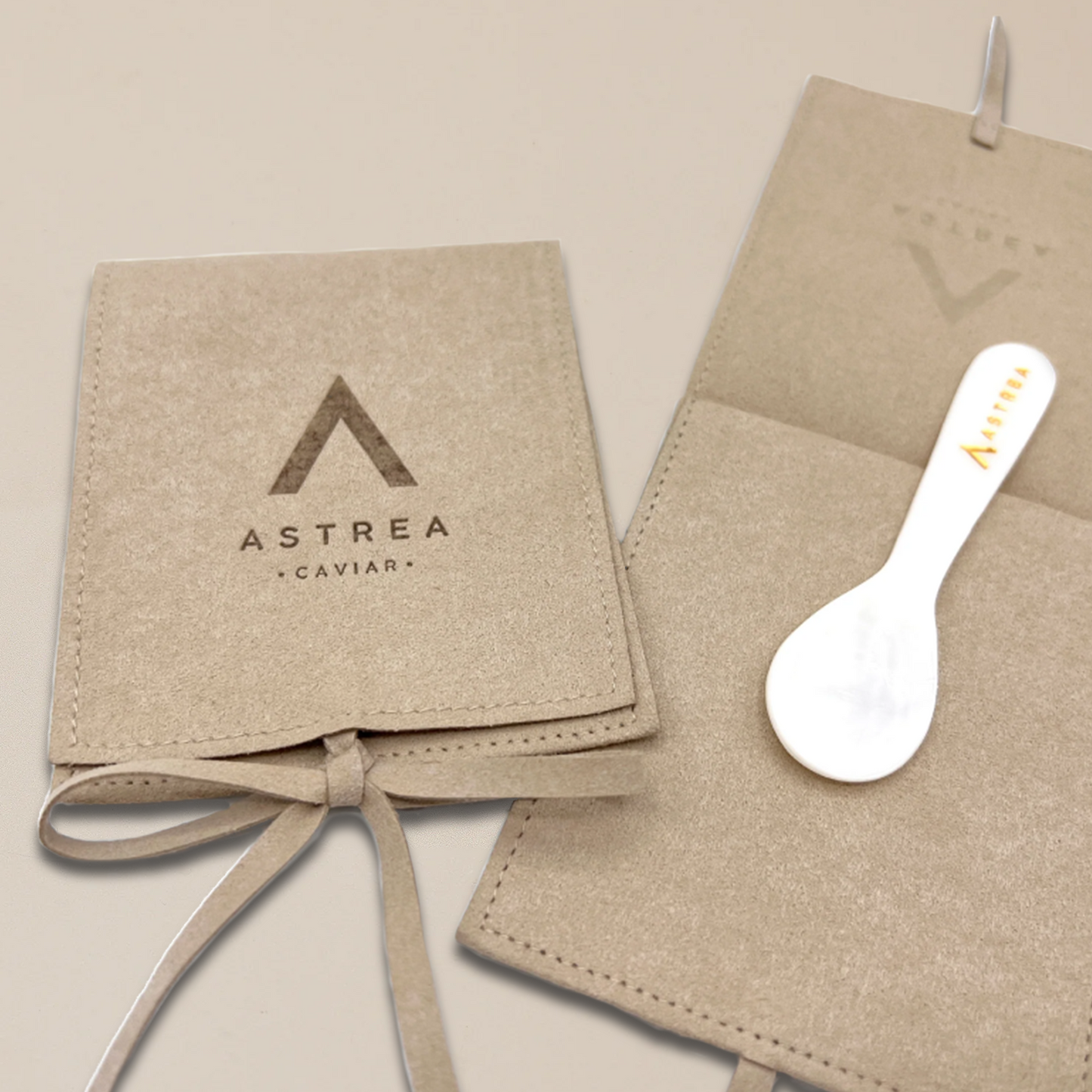 a white spoon on top of a bag with the word astrea on it